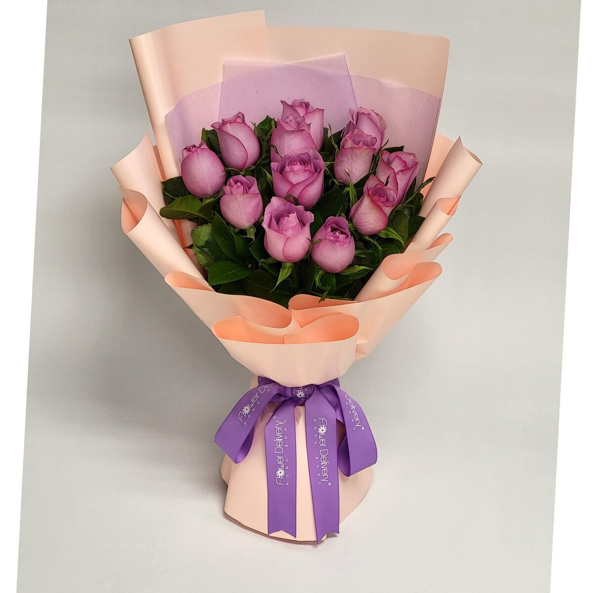 Original full bouquet of lavender-pink roses arranged with green leaves, wrapped in peach and lilac paper, tied with a purple ribbon - 粉紫玫瑰花束配綠葉,粉橙與紫紙包裝,紫絲帶繫綁