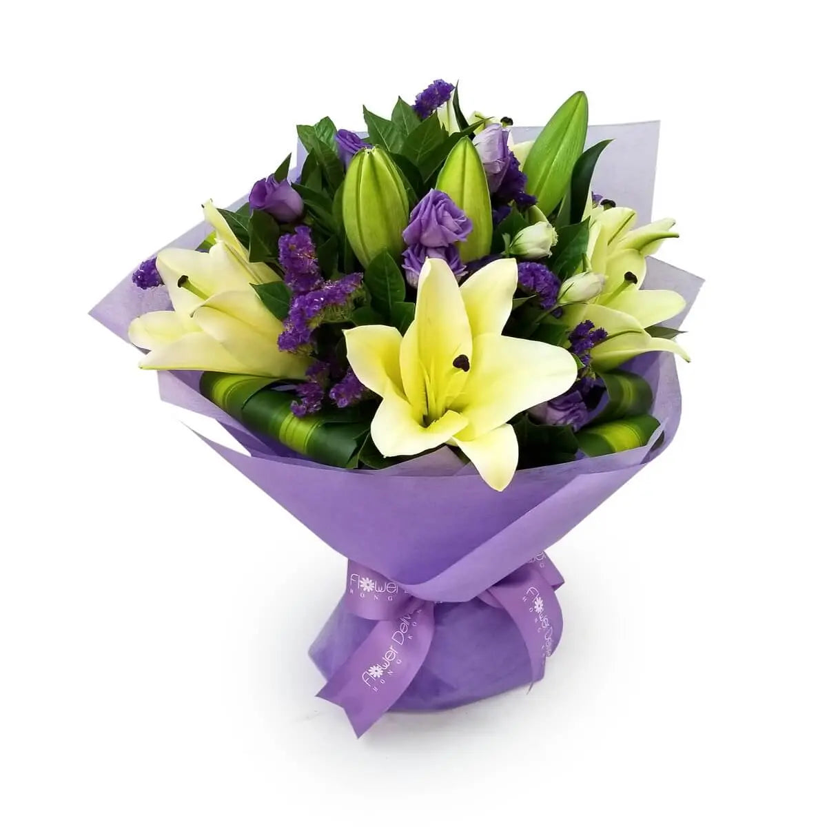 Yellow lilies, purple eustoma, and statice arranged with greenery in lavender wrapping. | 黃百合、紫桔梗與情人草配綠葉設計,採用紫色包裝紙包裹。