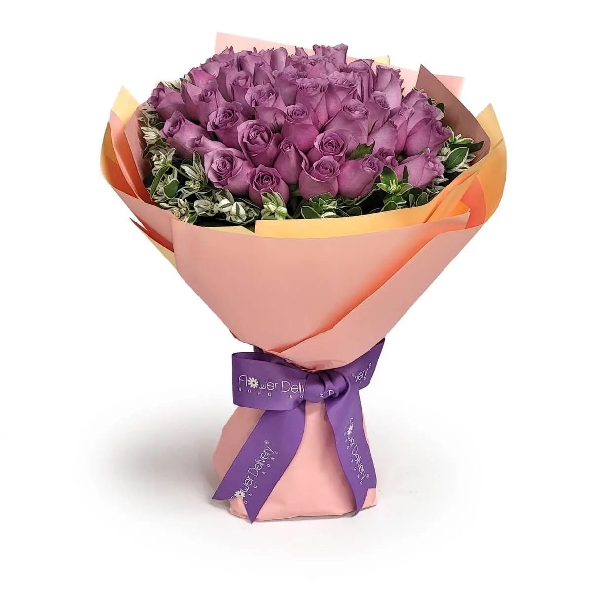 Hand-tied bouquet of lavender roses surrounded by variegated greenery, wrapped in peach and yellow paper and finished with a purple ribbon. 淺紫玫瑰手綁花束,配彩葉綠葉,包以桃黃紙及紫絲帶裝飾。