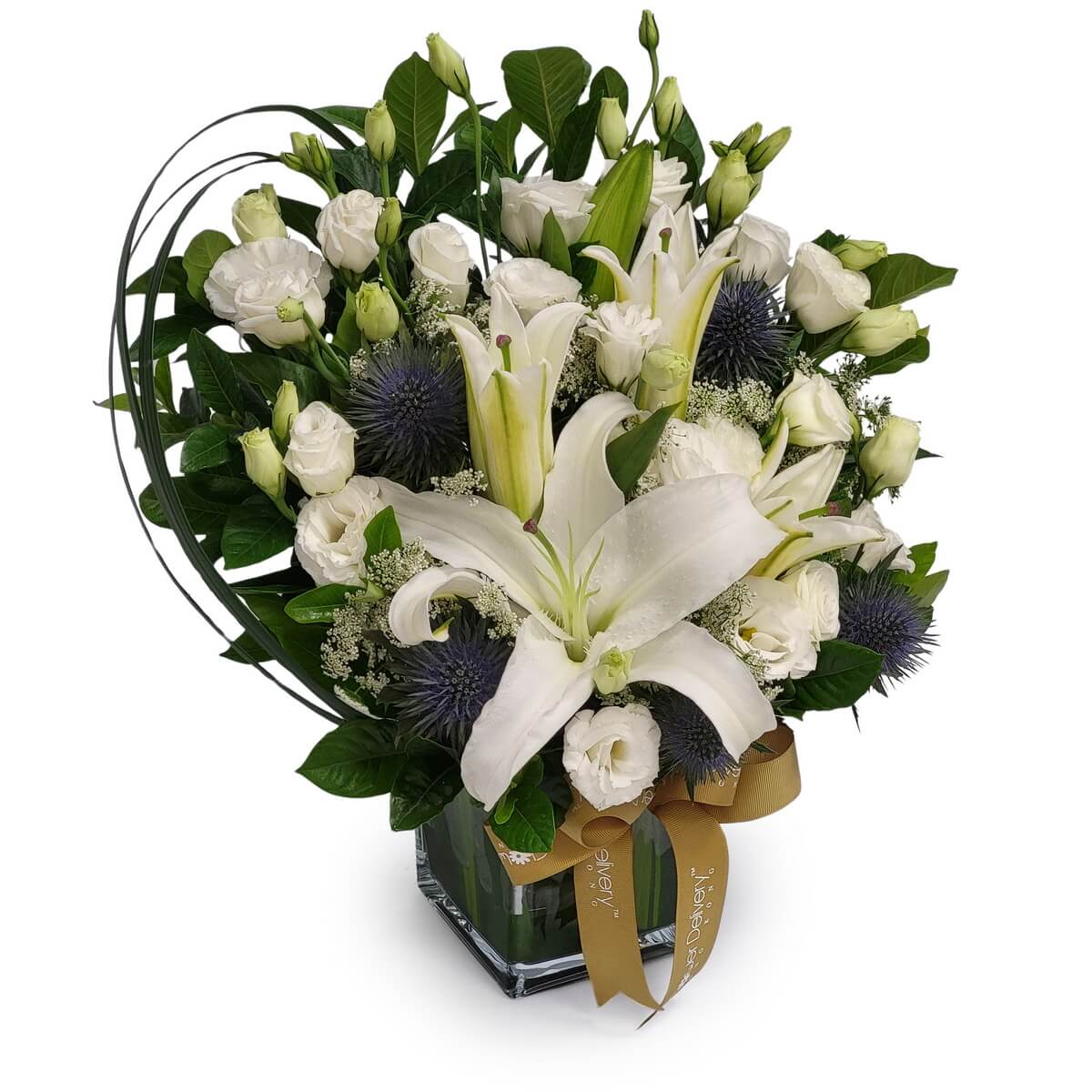 Elegant mix of white lilies, white roses, lisianthus, blue eryngium, and greenery arranged in a square glass vase with gold ribbon | 白百合、白玫瑰、桔梗、藍松球花及綠葉,插於方形玻璃瓶中,綁以金絲帶