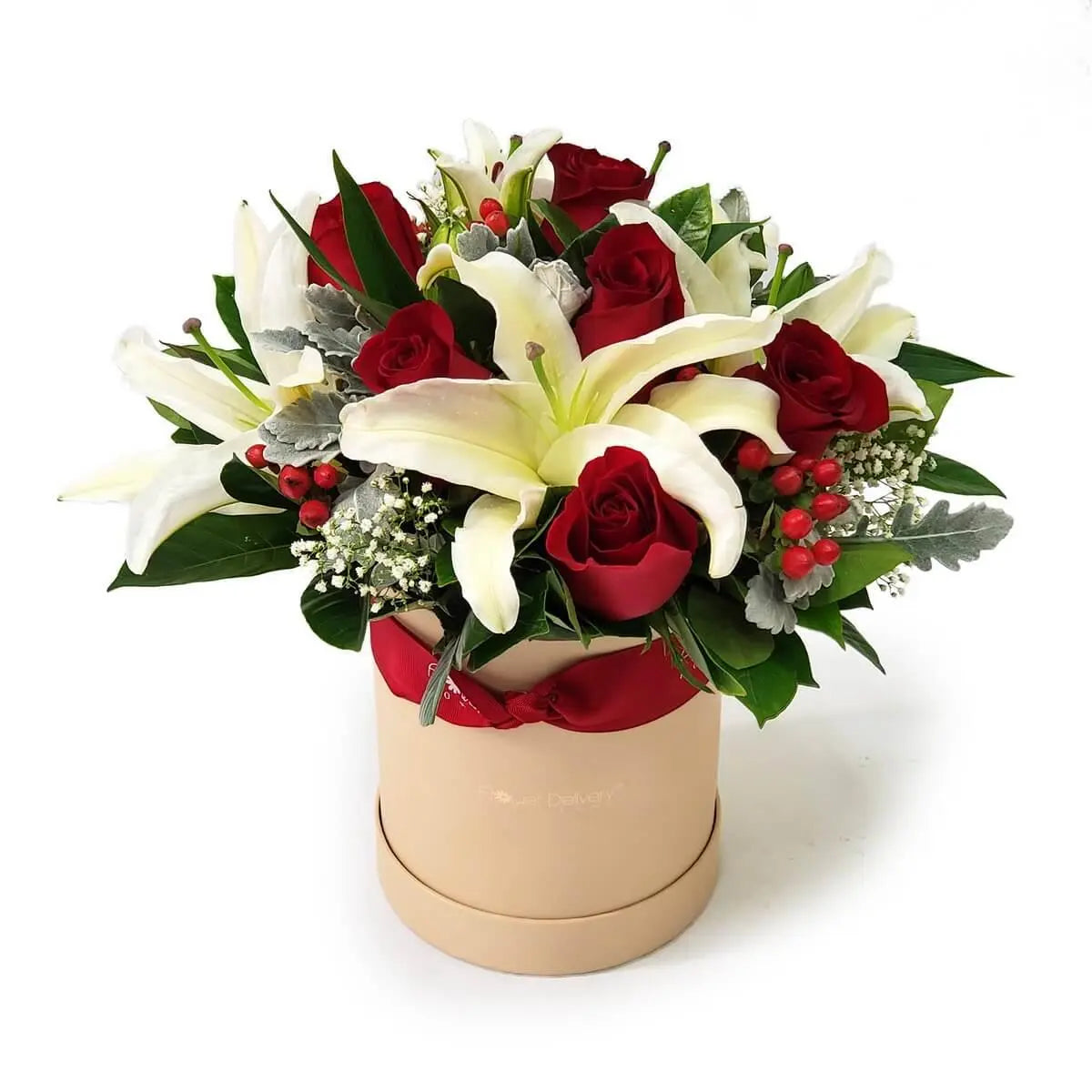 Elegant arrangement of white lilies and red roses with red hypericum berries, dusty miller, and lush foliage in a beige round box | 白百合配紅玫瑰與紅色聖誕果、銀葉菊及綠葉,置於米色圓形禮盒中