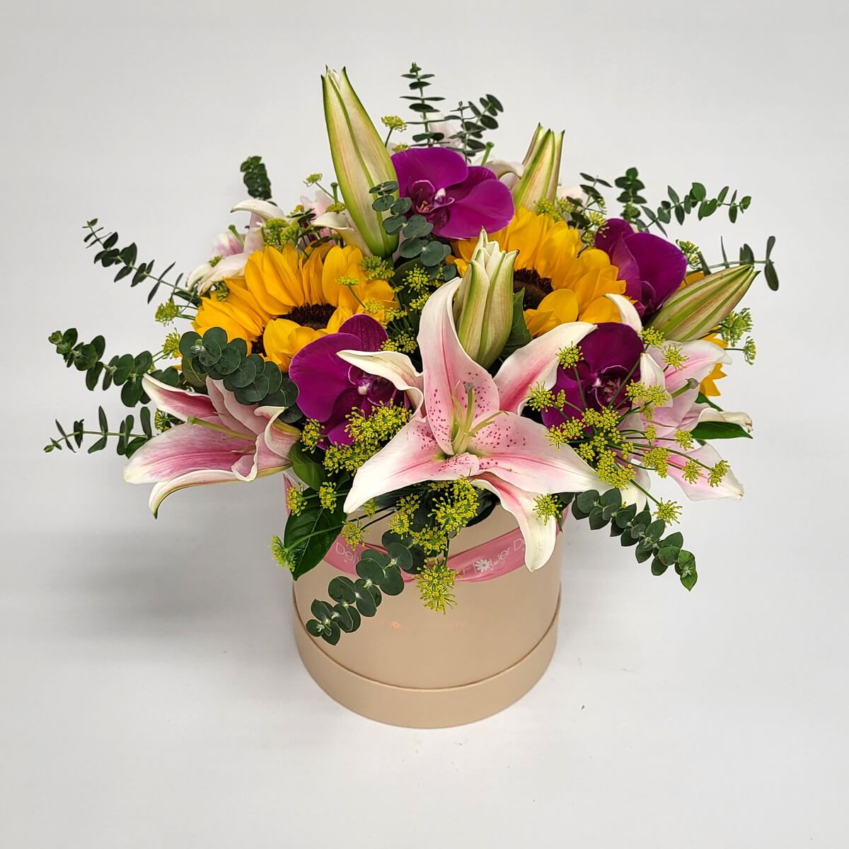 Original image of round box with pink stargazer lilies, yellow sunflowers, purple orchids, green fillers, and eucalyptus - 粉紅香水百合、黃色向日葵、紫蝴蝶蘭、綠色配花與尤加利葉圓形花盒