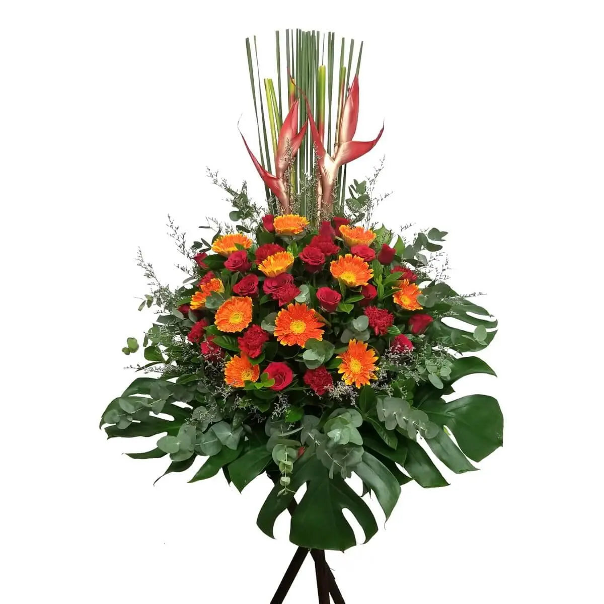Standing floral display with orange gerberas, red roses, red carnations, heliconia, monstera, eucalyptus, and mixed tropical greenery | 花牌配橙色非洲菊、紅玫瑰、紅康乃馨、天堂鳥、龜背竹、銀葉尤加利及熱帶葉材,層次分明造型挺拔。