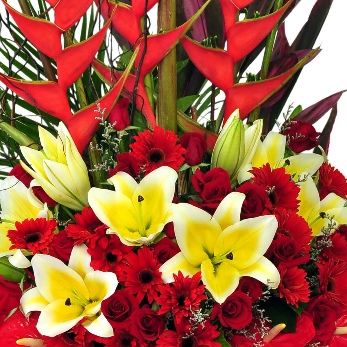 Tropical floral arrangement with yellow lilies, red roses, red gerbera daisies, and tall heliconias – 熱帶花藝設計,搭配黃百合、紅玫瑰、紅太陽菊與高挺火鶴花