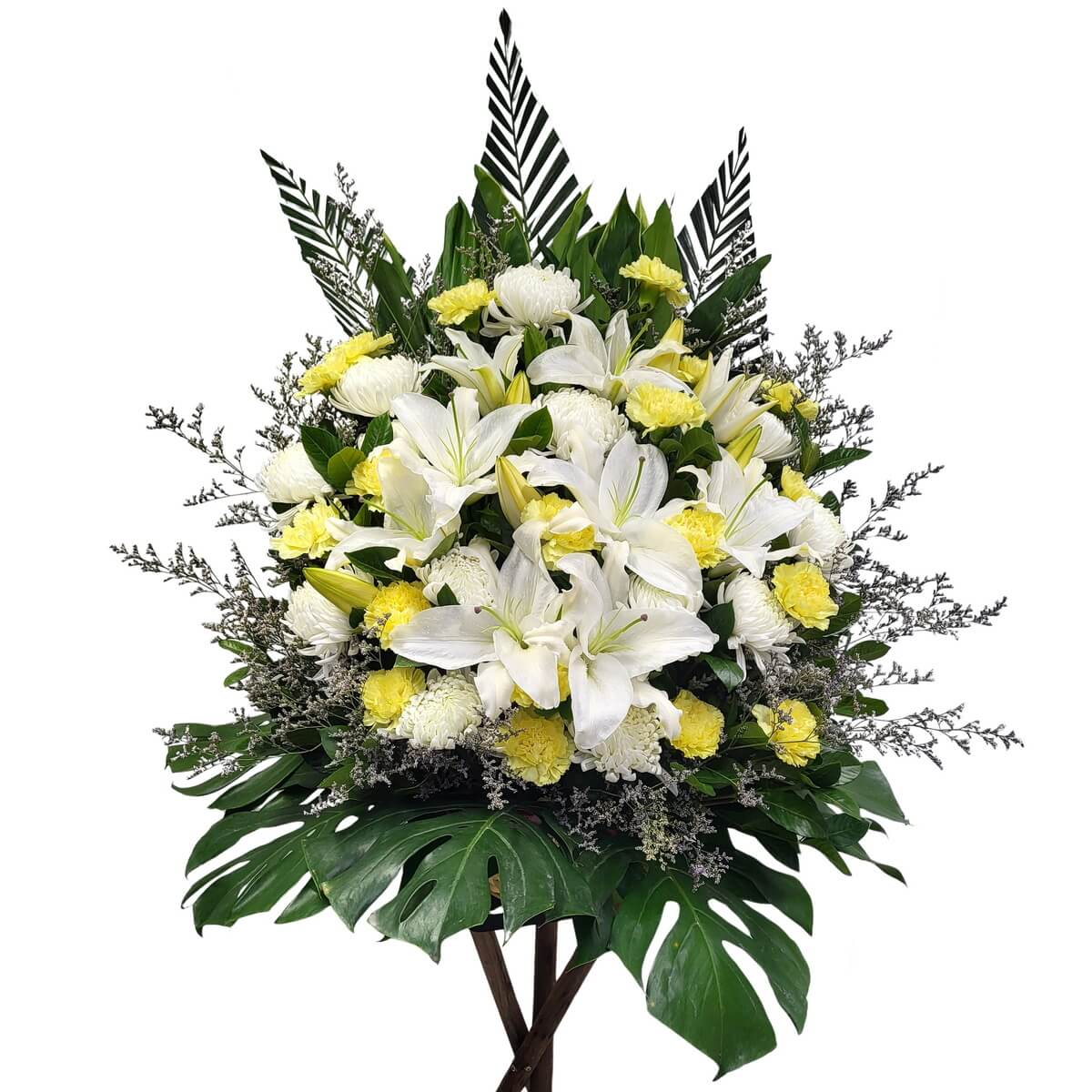 Standing floral display with white oriental lilies, yellow carnations, and white chrysanthemum, accented with palm and monstera leaves - 白東方百合、黃康乃馨與白菊花立式設計,配棕櫚及龜背葉