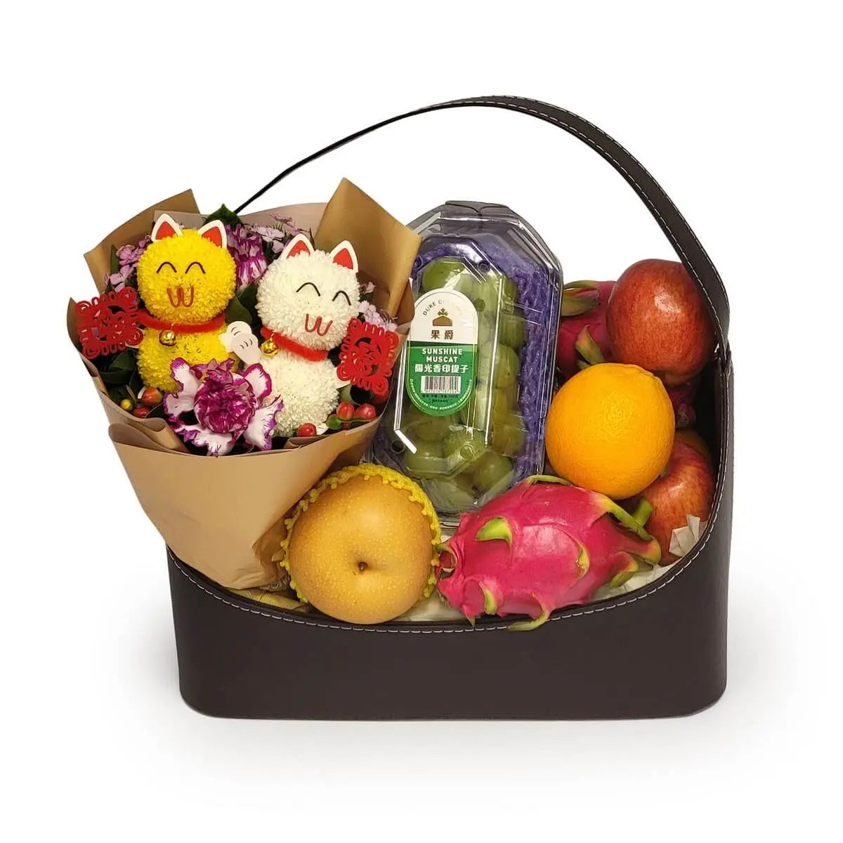 Assorted fruit basket featuring plush lucky cats, carnations, green grapes, apples, orange, dragon fruit, and pear in a dark leather case | 深色皮革禮籃,配吉祥貓公仔、康乃馨、青提、蘋果、橙、火龍果及雪梨。