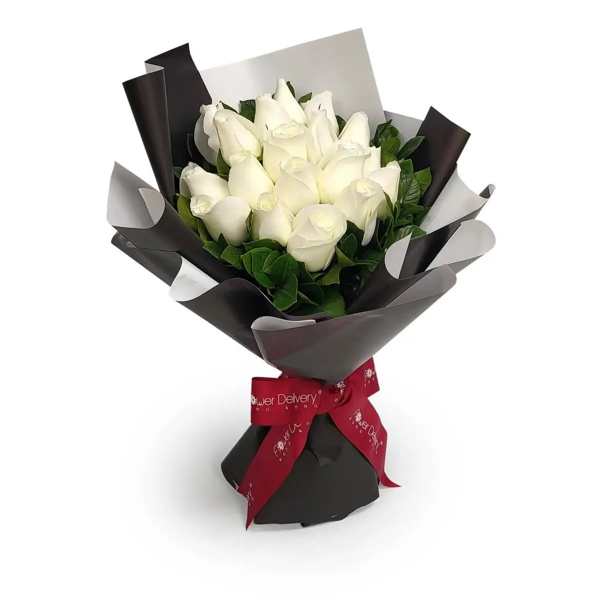 Hand-tied bouquet of white roses accented with green foliage, wrapped in layered black and white paper and finished with a deep red ribbon | 白玫瑰配以綠葉,層次黑白包裝紙包裹,紅色絲帶綁紮,典雅時尚
