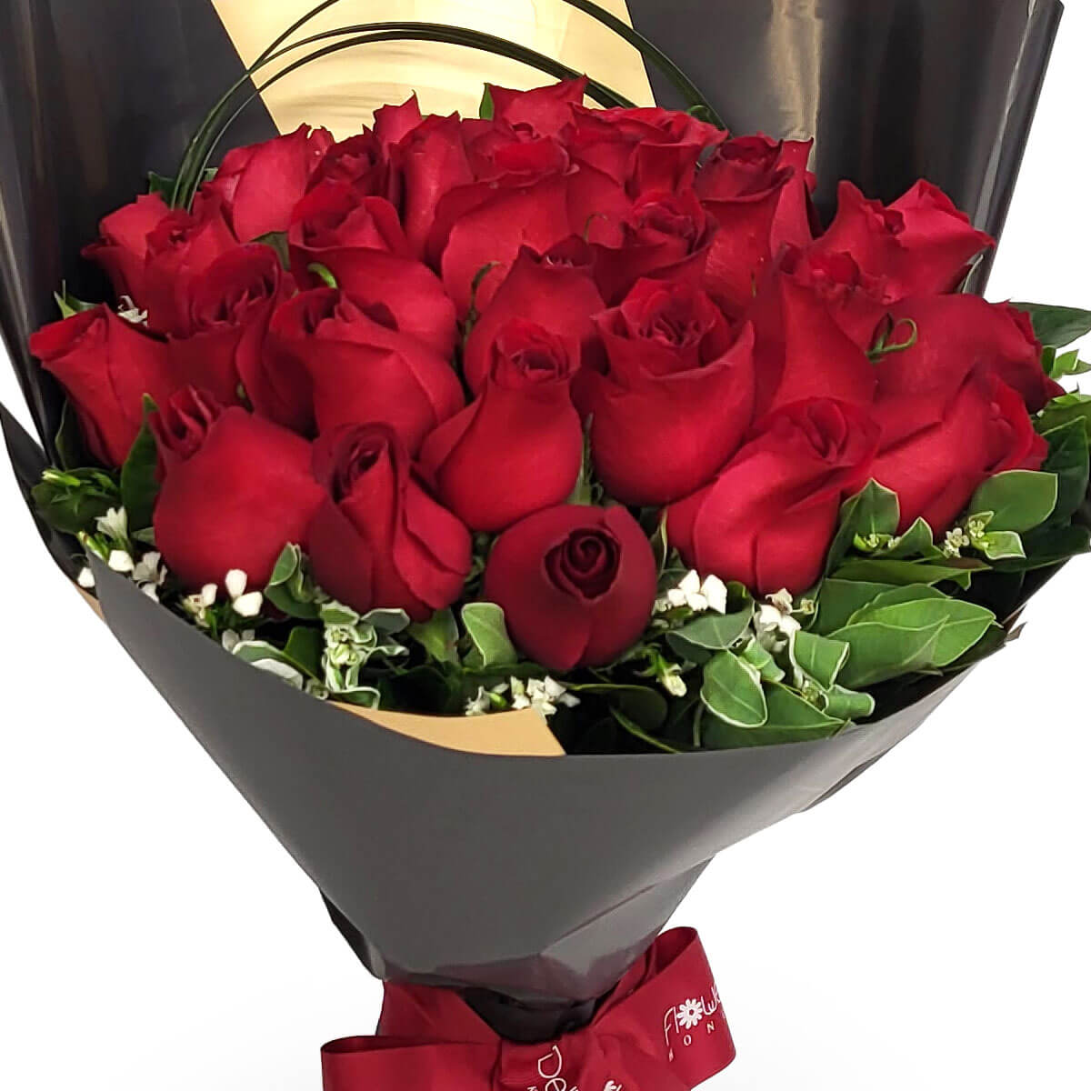 Striking bouquet of deep red roses arranged with rich green leaves, wrapped in black and gold paper with a red ribbon – 深紅玫瑰與綠葉交織,黑金包裝配紅絲帶,華麗典雅