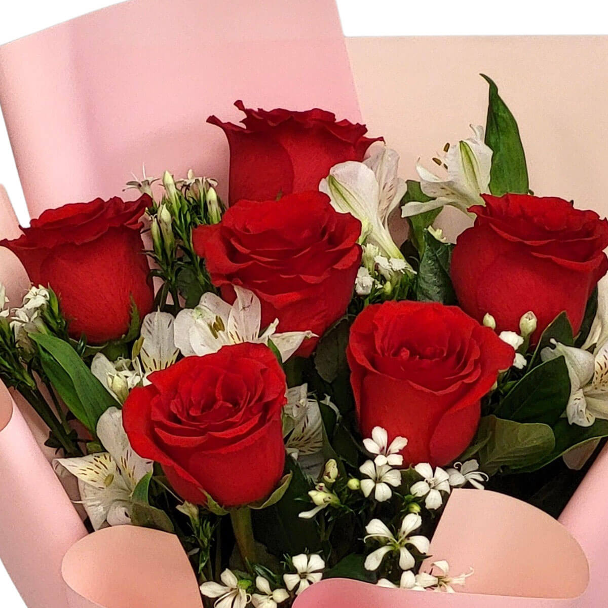 A graceful bouquet of red roses and white lilies, wrapped in blush pink 紅玫瑰與白百合在粉色包裝中綻放,象徵熱情與純潔的完美結合,甜美且動人。