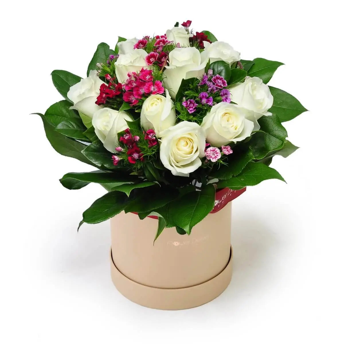 Arrangement of white roses with vibrant magenta and purple filler blooms, accented by glossy greens and displayed in a nude round box | 白玫瑰花襯以紫紅小花和亮綠葉材,設於米色圓形花盒中,色彩鮮明層次分明。