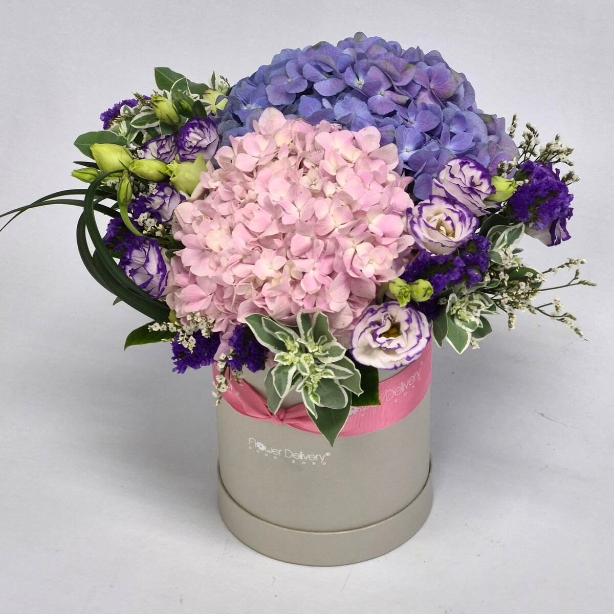 Happy Mother's Day flower arrangement in cream gift box featuring blue and blush pink hydrangeas, white and purple lisianthus, purple statice with green foliage and pink ribbon - 母親節花束禮盒,淺藍及粉紅色繡球花、白色及紫色洋桔梗、紫色勿忘我,配綠色葉材及粉紅絲帶