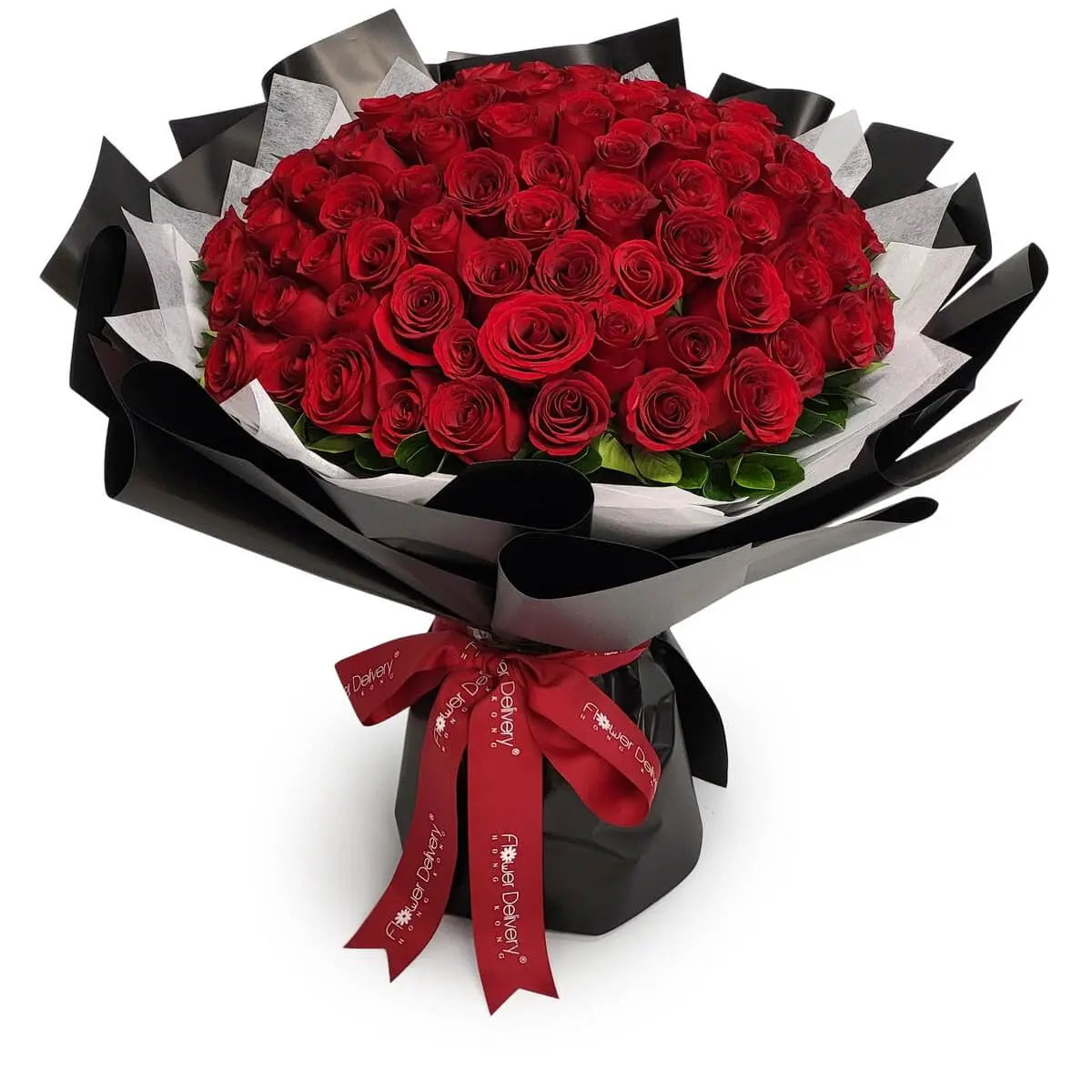 Large bouquet of red roses with green foliage, wrapped in layered black-and-white paper and tied with a red ribbon. | 大束紅玫瑰配綠葉，層次分明的黑白包裝紙及紅絲帶綁紮。