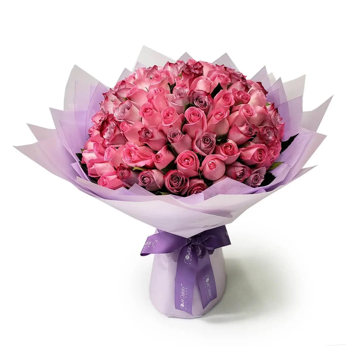 Bouquet of tightly packed pink and mauve roses, wrapped in layers of lavender and white paper with purple ribbon | 緊密排列的粉紅與淡紫玫瑰花束，層次紫白包裝紙包裹，配紫色絲帶裝飾