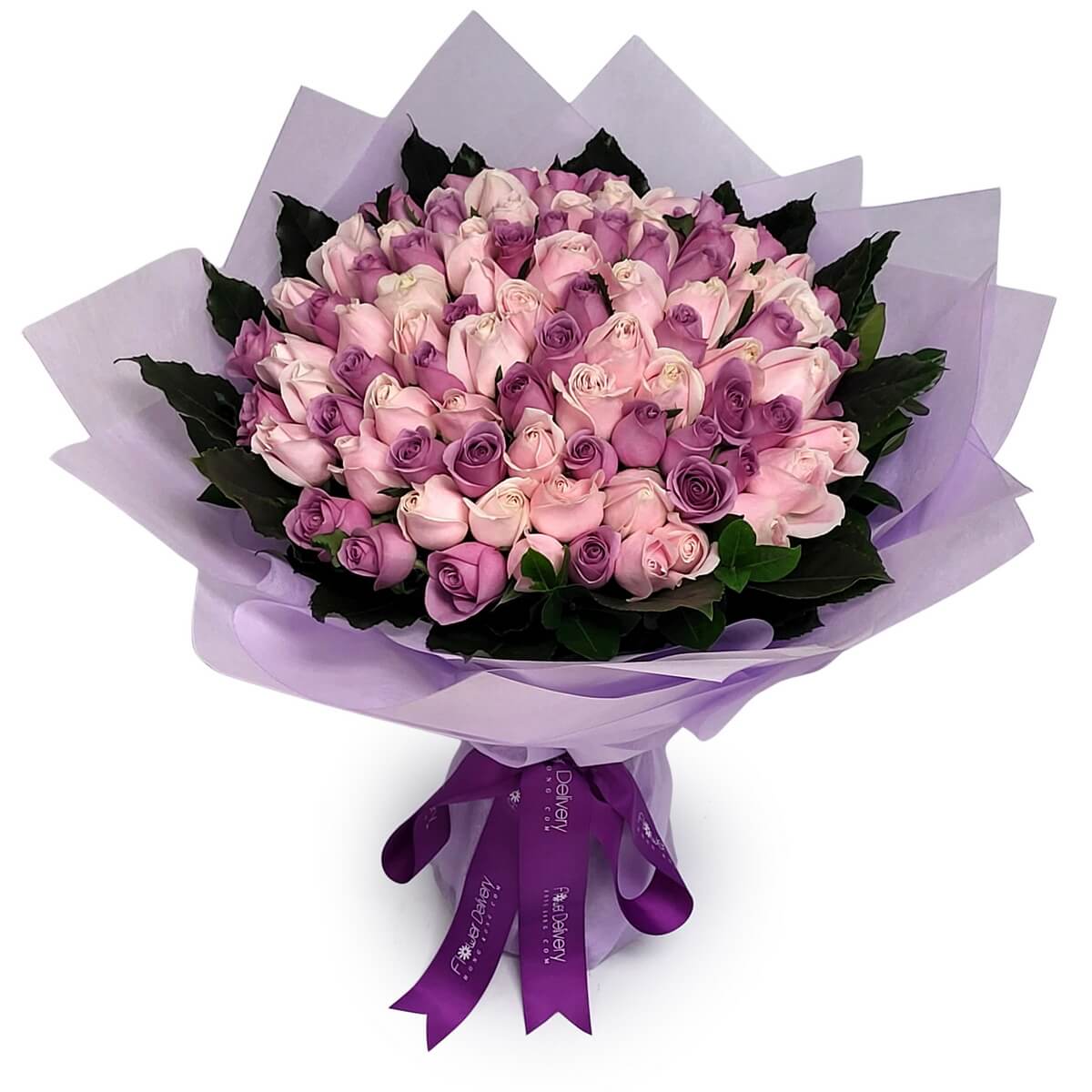 Large round bouquet of 99 lavender and pale pink roses with green foliage, arranged in a dense spiral style and wrapped in layered lilac paper - 99支紫色及淺粉玫瑰圓形花束，配綠葉及紫色包裝紙層次包裹