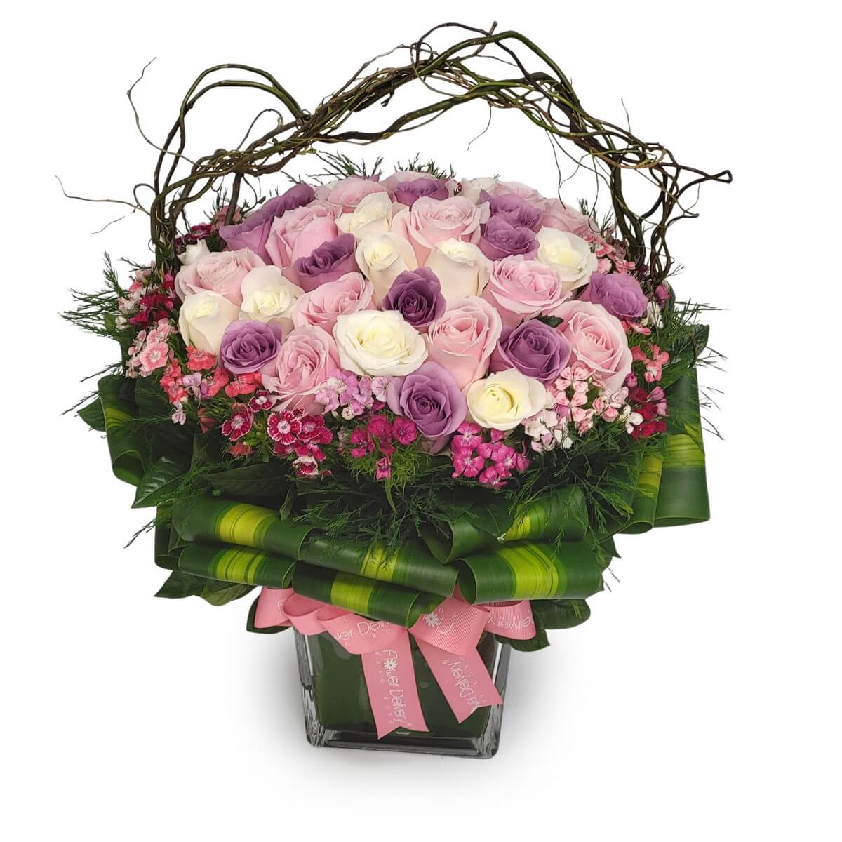 Basket of pink-lavender-white roses and pink dianthus in glass vase with greens. 淺紫粉紅白玫瑰配粉紅石竹，玻璃花瓶綠葉點綴。