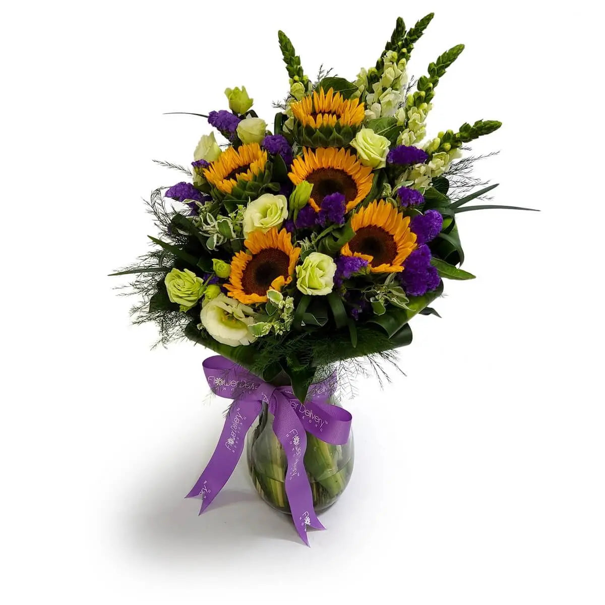 Arrangement of sunflowers, green lisianthus, purple statice, white snapdragons, and foliage in a clear vase tied with purple ribbon | 向日葵、青綠桔梗、紫色勿忘我、白色金魚草及綠葉，插於透明花瓶，綁以紫絲帶