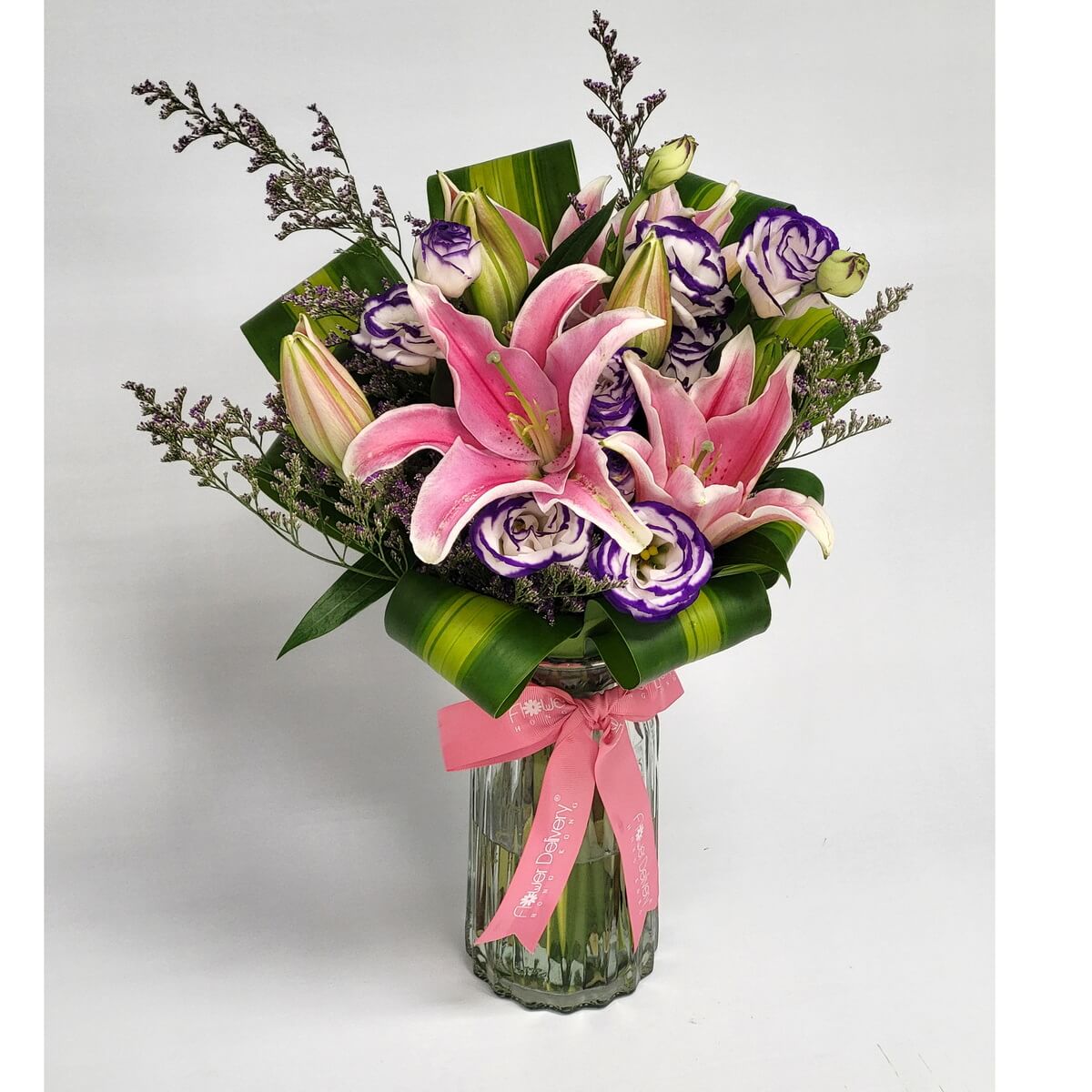 Original photo of glass vase bouquet of pink lilies and purple-white lisianthus, accented with folded greenery - 粉百合紫白洋桔梗襯摺葉玻璃瓶花束