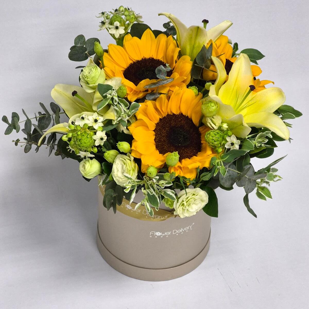 Authentic photo of sunflower and yellow lily round flower box arrangement with light green lisianthus and lisianthus buds - 真實照片向日葵與黃色百合圓形花盒花藝配淡綠洋桔梗及洋桔梗花苞