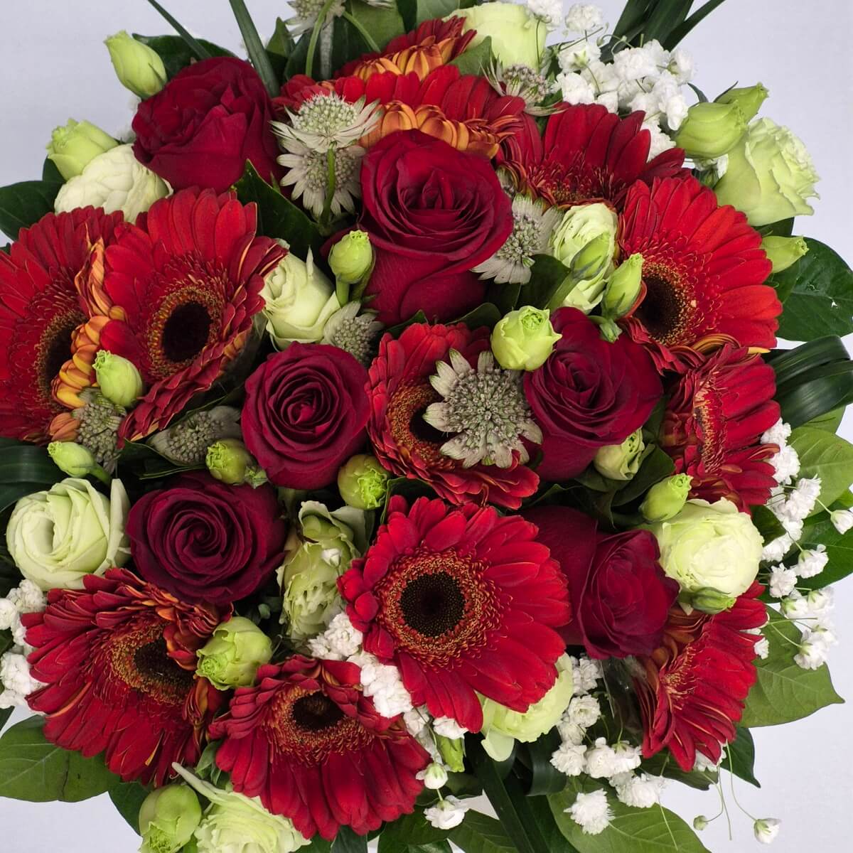 Top view close-up of red roses and red gerbera daisies with white flowers - 紅玫瑰與紅色非洲菊配白色花材花藝設計頂視細節