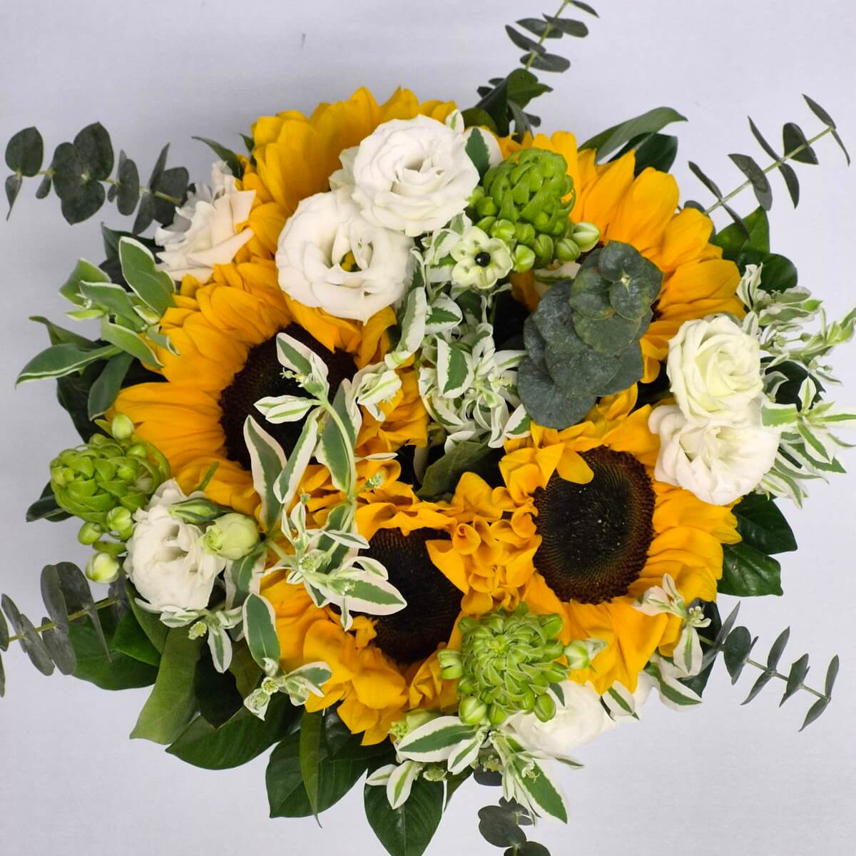 Top view close-up of sunflower and white rose flower arrangement with greenery - 向日葵配白玫瑰及綠葉花藝頂視角細節