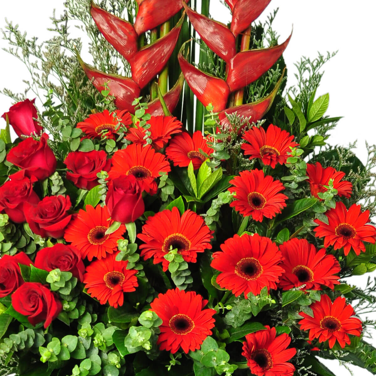 Striking red heliconias rise above a full arrangement of red gerberas and roses, accented with vibrant greenery – 醒目的紅色天堂鳥高聳於紅色非洲菊與玫瑰花束上，搭配鮮綠葉材展現豐富層次