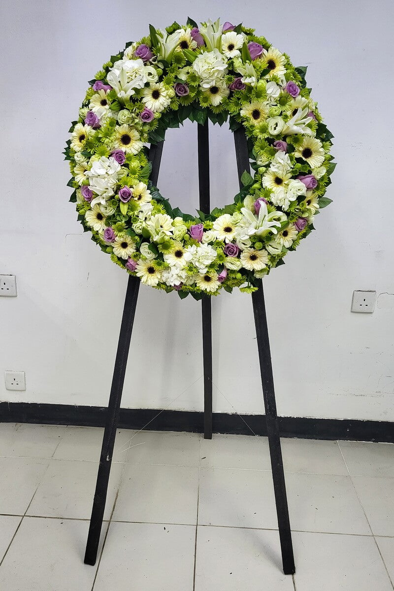 Full standing floral wreath of white lilies, purple roses, ivory hydrangeas, cream gerberas, lisianthus and green pom-pom chrysanthemums - 白百合、紫玫瑰、象牙白繡球花、奶白非洲菊、洋桔梗及綠色小菊花企身花圈