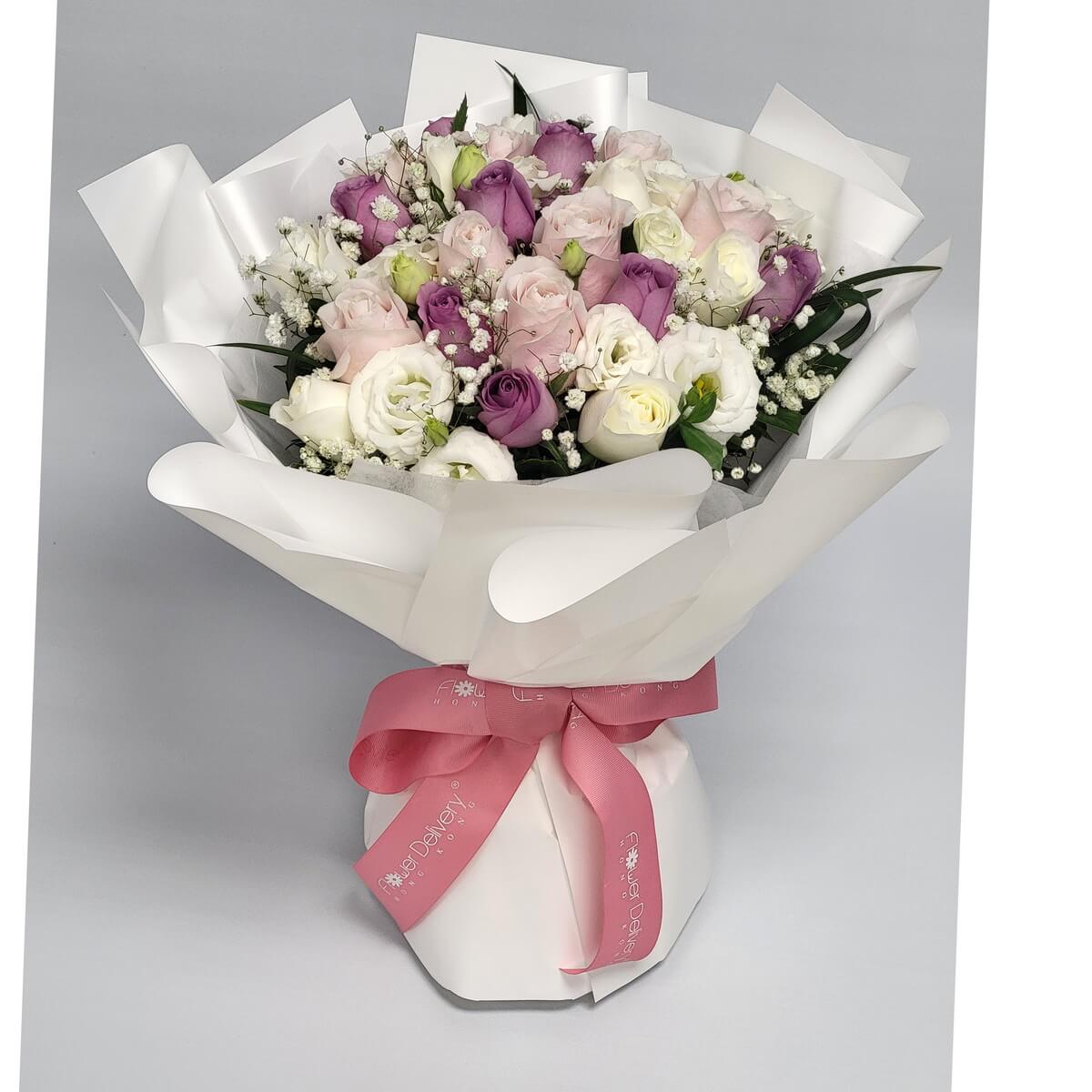 Original photo of hand-tied bouquet of purple, blush pink, and ivory roses with baby's breath and white lisianthus, wrapped in white - 紫粉白玫瑰、滿天星及白洋桔梗配白色包裝的手綁花束