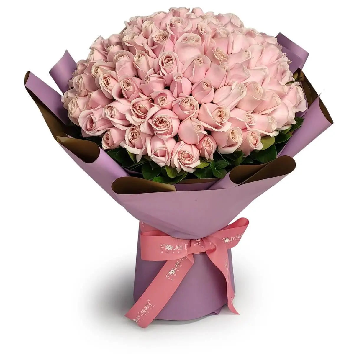 Full bouquet of pastel pink roses arranged in dome shape with vibrant green leaves, wrapped in lilac paper and pink ribbon | 淡粉玫瑰環繞成圓形花球，翠綠葉片點綴其中，紫色包裝配粉絲蝴蝶結，清新柔美。