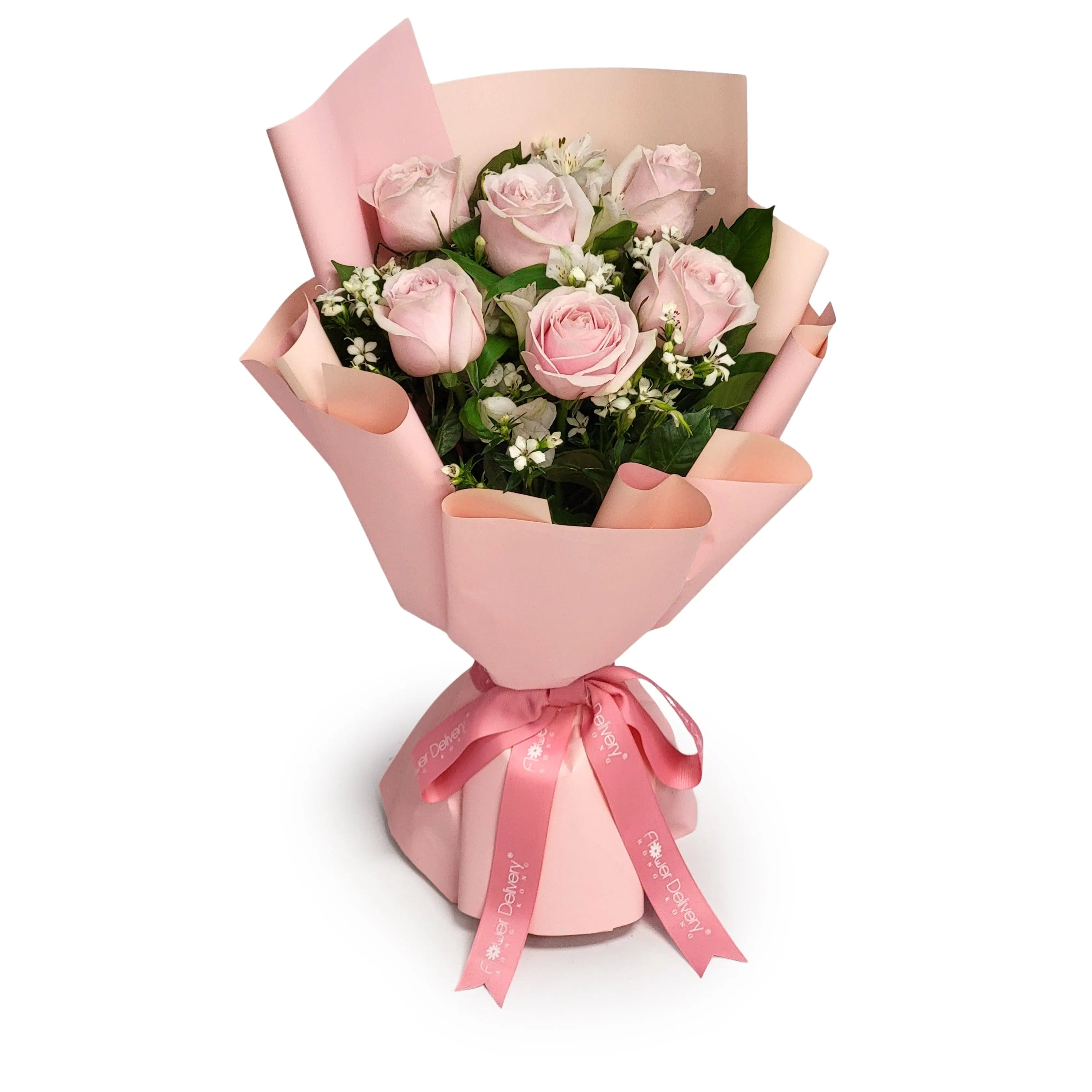 Hand-tied bouquet of soft pink roses, white accent blooms, and glossy greenery, wrapped in blush pink paper and finished with a satin pink ribbon | 淡粉玫瑰襯白色配花與亮綠葉材，手綁成束並用粉紅包裝紙及絲質絲帶精緻包裹。