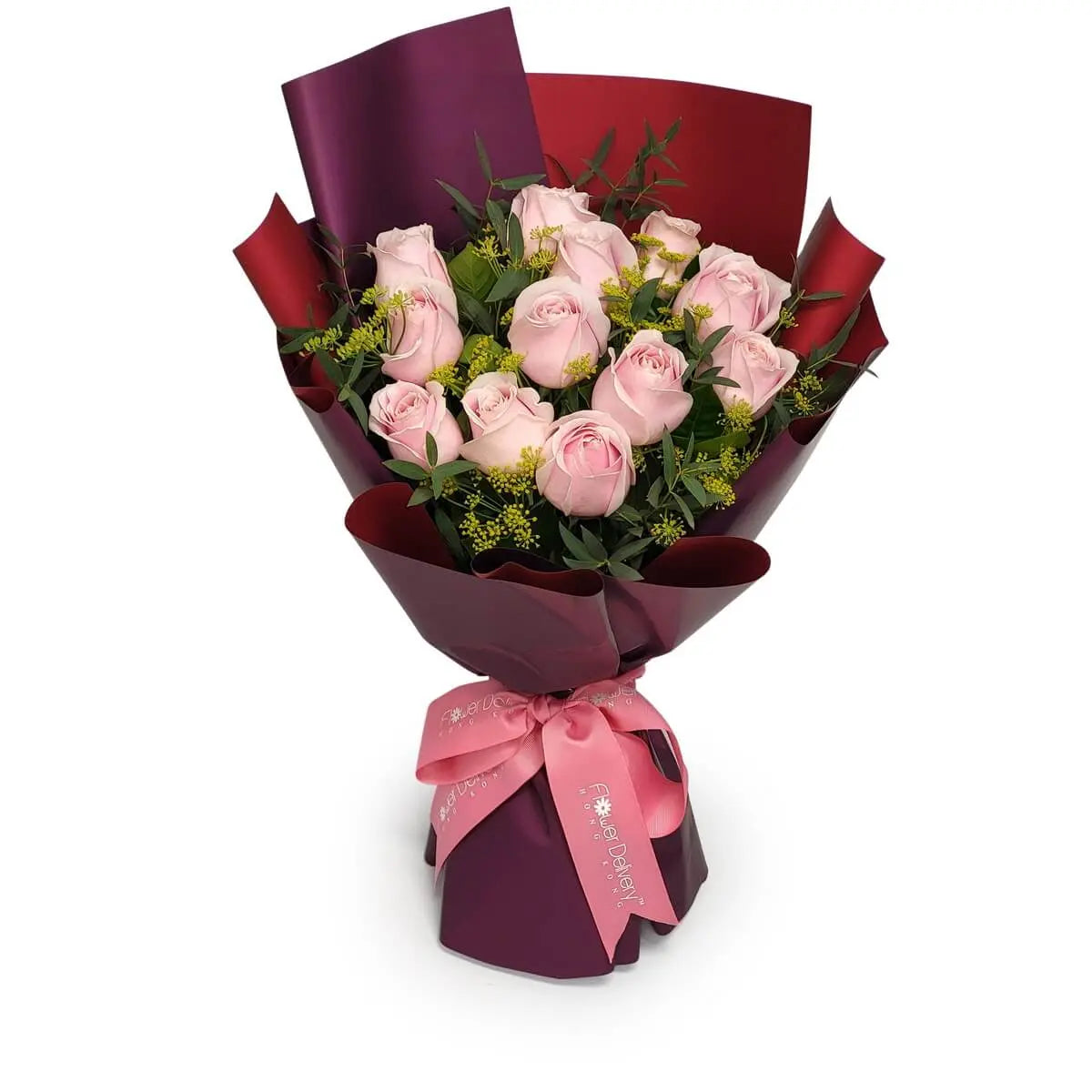 Bouquet of light pink roses, yellow filler flowers, and greenery, wrapped in red-purple paper and tied with pink satin ribbon | 淺粉玫瑰搭配黃色襯花與綠葉，紅紫色包裝紙配粉紅絲帶包裹成花束。
