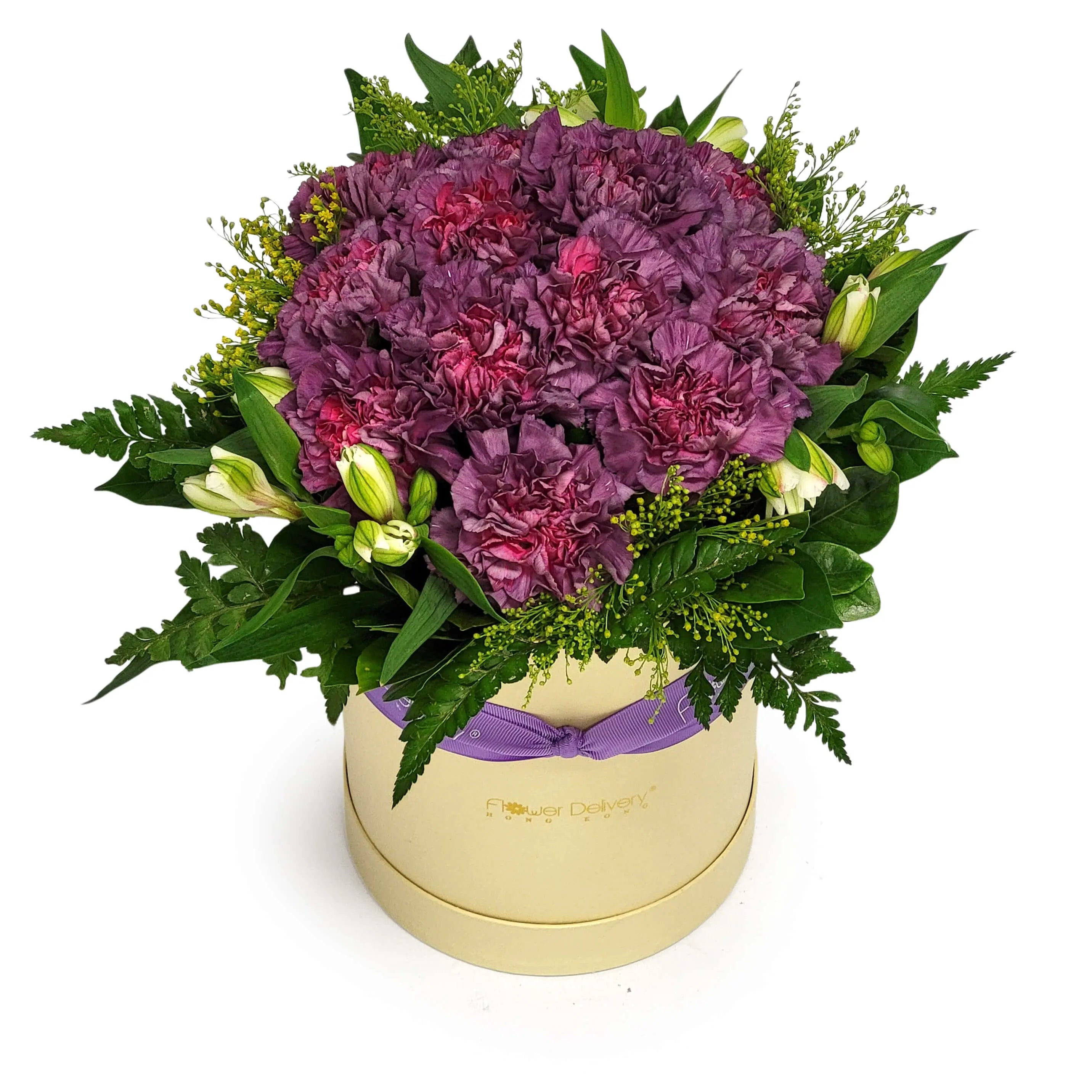 Box arrangement of purple carnations with white alstroemeria buds, solidago, and mixed foliage, finished with a lavender ribbon. 圓形禮盒設計，紫色康乃馨配白色六出花苞、黃金球及綠葉，綁以淡紫絲帶。
